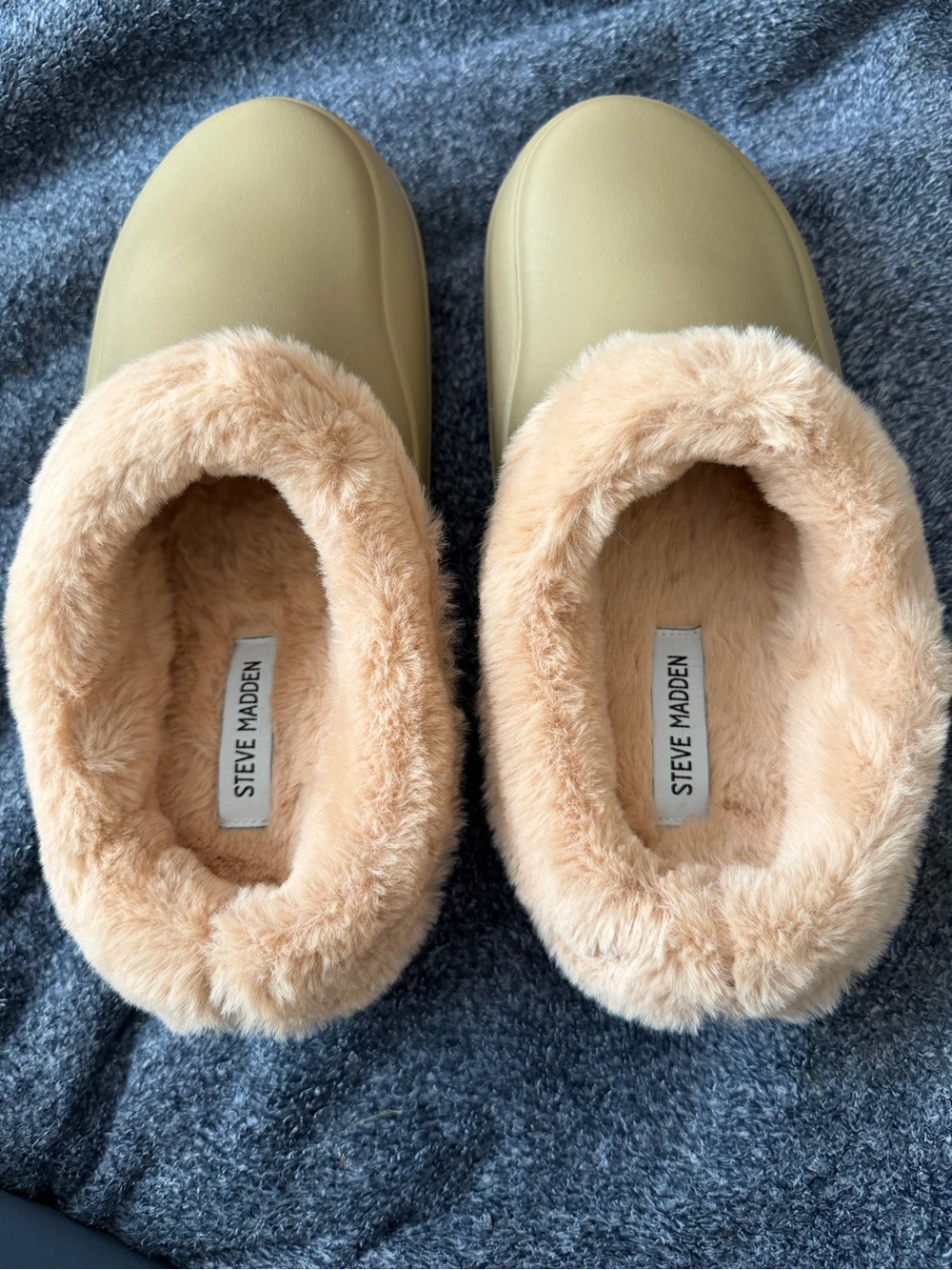 Steve Madden slip-on clog mule with a rubberized exterior in tan or olive tone.
